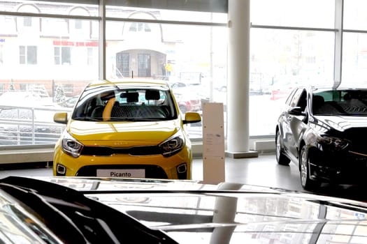 Kazan, Russia - November 25, 2022: Cars in showroom of dealership Kia in Kazan in Russia. Partial focus