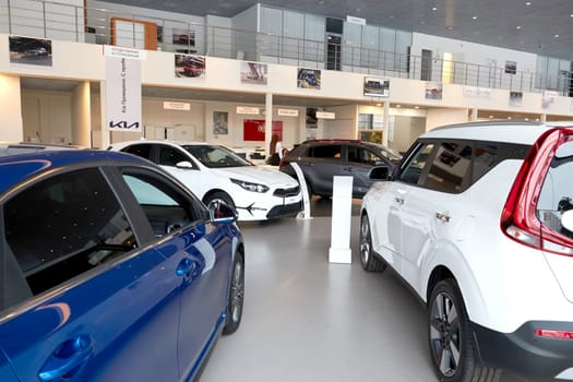 Kazan, Russia - November 25, 2022: Cars in showroom of dealership Kia in Kazan in Russia. Partial focus