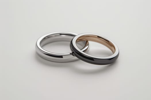 Two wedding rings cut out. Based on Generative AI.