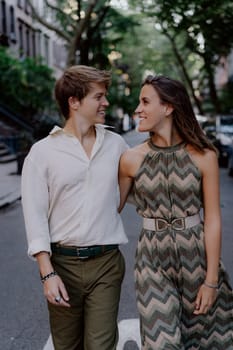 A couple enjoys a stroll through the bustling city, capturing a moment of happiness and deep connection