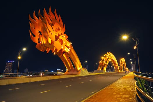 Traffic on the Dragon Bridge over Han River in Da Nang in Vietnam at night