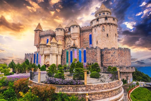 Fantastic beautiful medieval castle at Ba Na Hills Amusement Park in Da Nang Vietnam at sunset