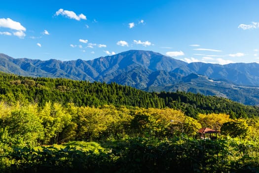 Hiking path landscape on the famous Magome-Tsumago Trail as part of the Nakasendo Way between Magome and Tsumago in Gifu Prefecture, Japan
