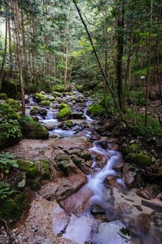 Hiking path landscape on the famous Magome-Tsumago Trail as part of the Nakasendo Way between Magome and Tsumago in Gifu Prefecture, Japan