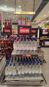 15 October 2024 Tel-Aviv Israel Ben Gurion airport, Terminal 3. duty free shop for tourists, sale of alcohol whiskey in bottles on the shelf, prices in dollars, in the travel hall. High quality photo