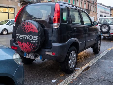Cremona, Lombardy, Italy October 15th 2024 Rear view of a black daihatsu terios suv parked on a city street, showcasing its spare wheel cover
