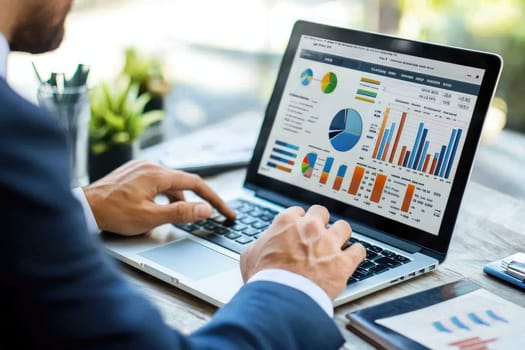 A business professional focused on analyzing visual data charts on a laptop in a bright office setting, showcasing financial insights through various graphs and diagrams.