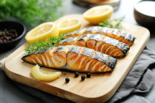 Succulent grilled salmon fillets are beautifully arranged on a wooden cutting board, garnished with fresh herbs and served alongside lemon slices. The vibrant colors create a tempting dish.