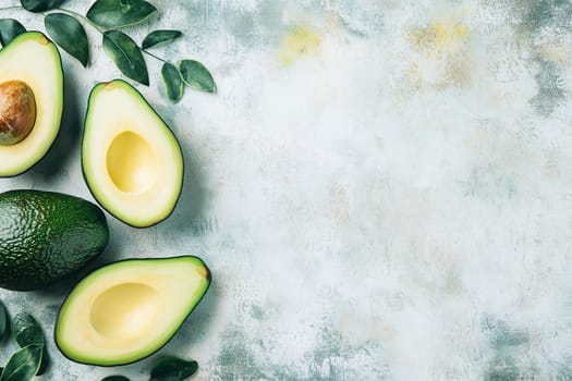 Bright, vibrant avocados are sliced in half and displayed alongside whole fruit and lush green leaves, creating a fresh, healthy atmosphere ideal for culinary creations.