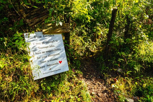 Hiking path garden on the famous Magome-Tsumago Trail as part of the Nakasendo Way between Magome and Tsumago in Gifu Prefecture, Japan