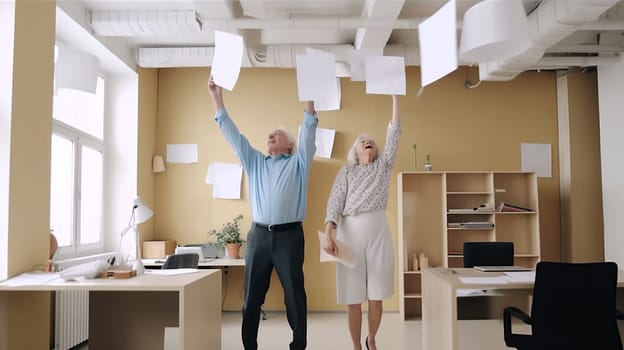 A man and a woman are joyfully throwing papers high up in the air, creating a cheerful and lively atmosphere all around them