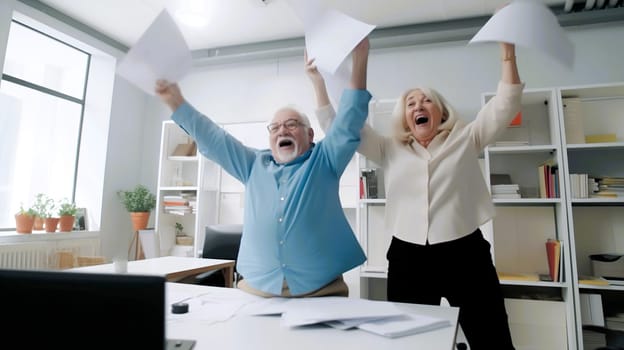 A man and a woman are joyfully throwing papers high up in the air, creating a cheerful and lively atmosphere all around them