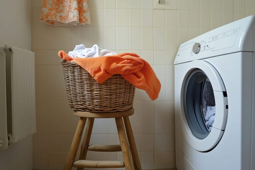 A wicker basket filled with colorful laundry sits on a wooden stool beside a washing machine in a bright, tidy laundry room, creating a cheerful atmosphere.