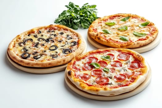 A tempting display of three various pizzas, including toppings of olives, pepperoni, and fresh basil, arranged on a wooden platter.