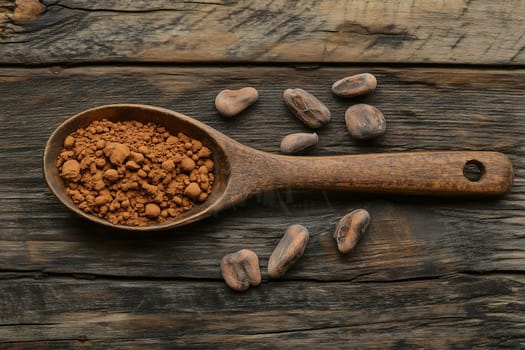 Cocoa powder, rich in color and texture, is seen in a wooden spoon surrounded by whole cocoa beans on a weathered wooden surface, highlighting natural ingredients.