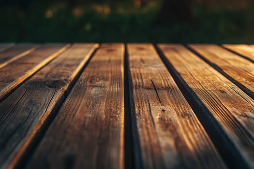 Sunlight filters through trees, casting a warm glow on a table made of polished wooden planks in a tranquil outdoor location during the afternoon.