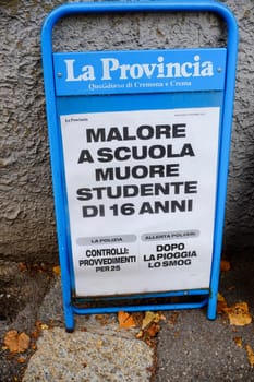 Cremona, Lombardy, Italy - November 7th 2024 Newsstand displaying la provincia newspaper with headline about sudden death of a student