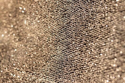 Horizontal blurred golden surface. Golden shiny material background. Pure gold wire mesh. Chrome bronze Fabric waves. 