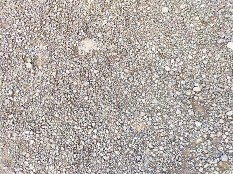 A coarse gravel surface spread across a construction area.