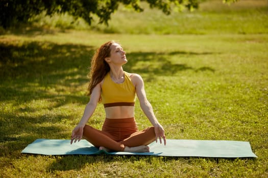 young girl doing yoga in nature, Asanas - poses in yoga for beginners, outdoor workout concept