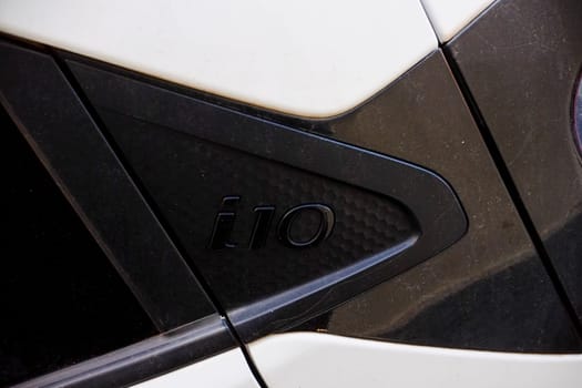 Cremona, Lombardy, Italy - November 7th 2024 Close-up of the i10 logo positioned on the c-pillar of a white hyundai i10, highlighting the car's model