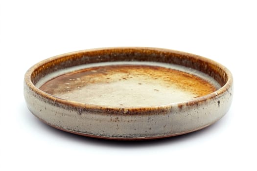 A handcrafted pottery dish features a unique, earthy glaze with a rich blend of brown and gray tones, ideal for serving or decor.