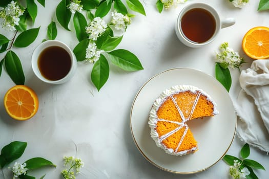 An inviting slice of orange cake sits on a plate, accompanied by two steaming cups of tea and scattered flowers, creating a warm afternoon ambiance.
