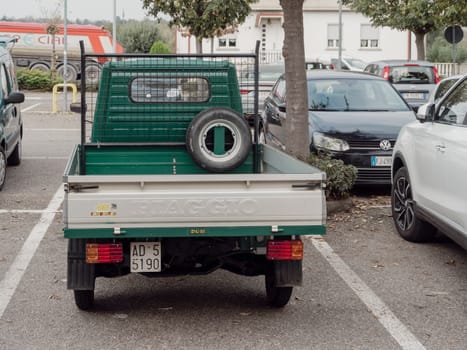 Arquato, PC, italy - October 31st 2024 Rear view of a green piaggio porter pickup truck parked in a parking lot, showcasing its compact size and practical design