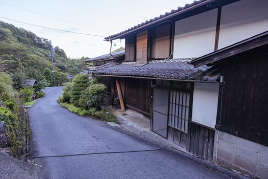 Hiking path and towns on the famous Magome-Tsumago Trail as part of the Nakasendo Way between Magome and Tsumago in Gifu Prefecture, Japan