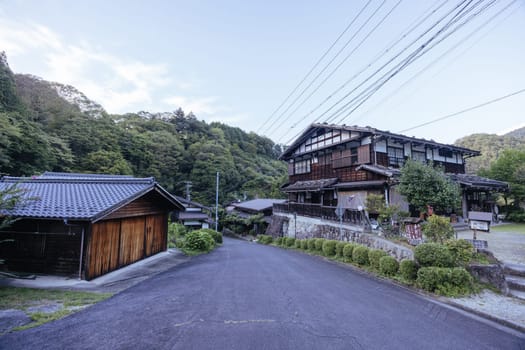 Hiking path and towns on the famous Magome-Tsumago Trail as part of the Nakasendo Way between Magome and Tsumago in Gifu Prefecture, Japan
