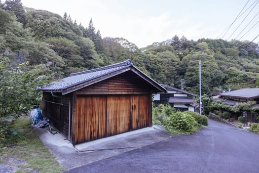 Hiking path and towns on the famous Magome-Tsumago Trail as part of the Nakasendo Way between Magome and Tsumago in Gifu Prefecture, Japan