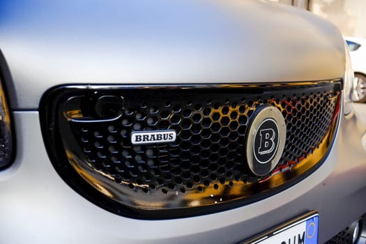 Cremona, Lombardy, Italy - November 7th 2024 Close-up of brabus logo on the customized front grille of a smart car, showcasing luxury tuning