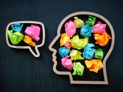 The contour of the head with colored paper balls as a symbol of positive thinking.