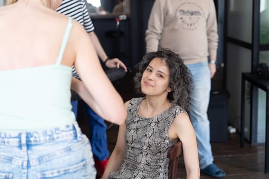 young beautiful woman doing makeup for woman