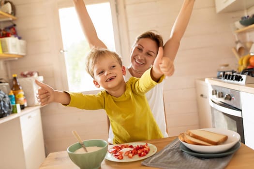 lifestyle concept, young mother and son spending time together at breakfast.