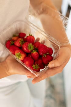 close-up of juicy berries in hand.