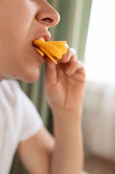 a young woman overeats on chips while on a diet. eating disorder.