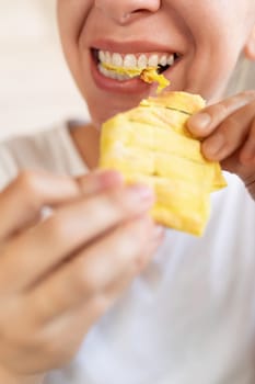 young woman enjoying food while dieting.