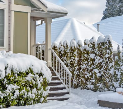 Porch and doorsteps of residential house in snow on winter season in Canada
