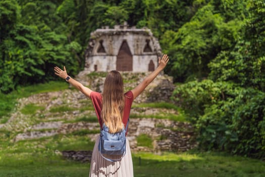Female tourist exploring the ancient pyramids of Palenque, Mexico, surrounded by dense jungle. Cultural heritage and adventure travel concept.