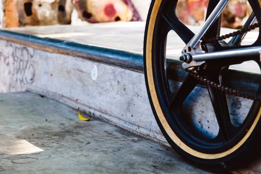Close up of bmx bike on a ramp in a skatepark, BMX concept.