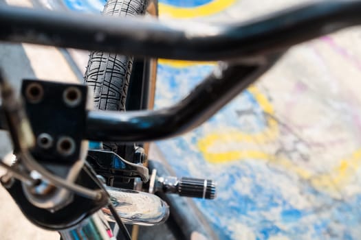 Close up of bmx bike on a ramp in a skatepark, BMX concept.