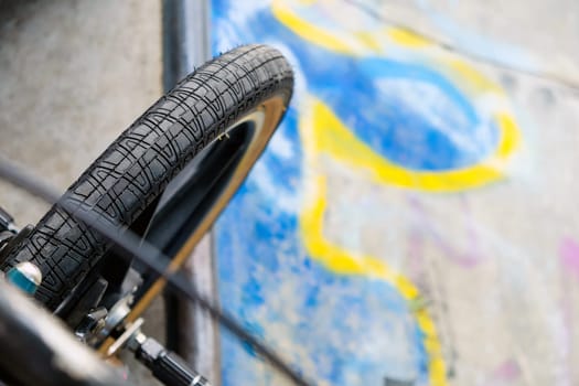 Close up of bmx bike on a ramp in a skatepark, BMX concept.
