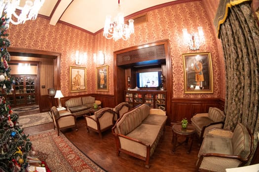 Jodhpur, Rajasthan, India - 25th Dec 2023: Elegant pink room with chandeliers filled with Christmas decorations showing the celebration of this festival in Rajasthan India shot with a fish eye lens