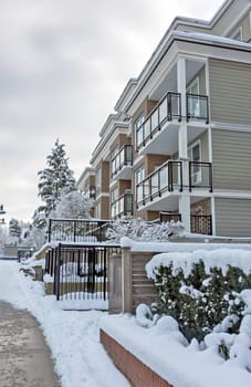 Low-rise residential building in snow on winter season in Vancouver, Canada.