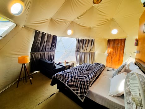 Interior of geodesic, triangular and swiss tents at a popular glamping spot near hampta village manali for eco freindly and comfortable adventure stays in India