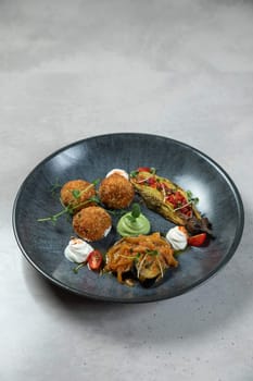 Delicious and healthy vegan meal is presented on a plate, featuring a variety of flavors and textures