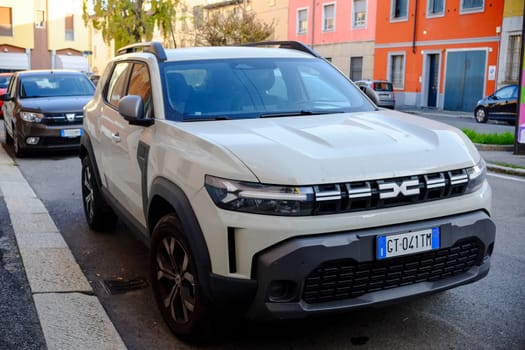 Cremona, Itally - October 6th 2024 Beige dr 6.0 1.5 turbo hybrid parked on a residential street, highlighting its contemporary design in an urban setting from the front view