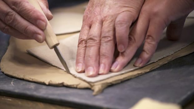 Skillful hands expertly shape clay, beautifully showcasing artistry and collaboration throughout ceramics. Stock Clip