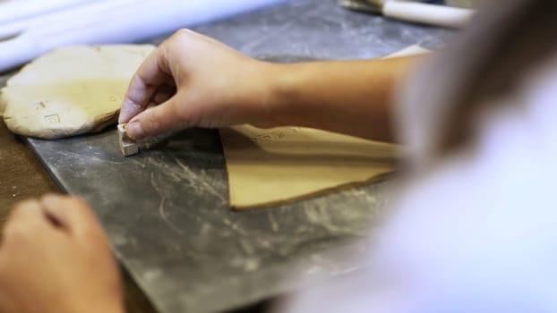 Artisan Hands at Work Passionately Crafting Beautiful Creations with Clay and Careful Precision. Stock Clip